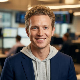 Profile image showing Ryan Brooks, listed as Lead Trading Analyst at Emberton Coralvik
